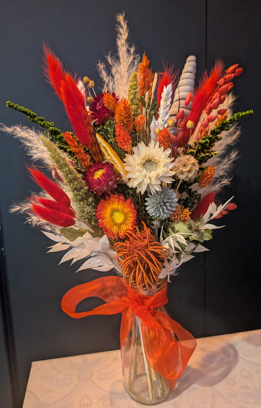 Christmas posy in a milk bottle