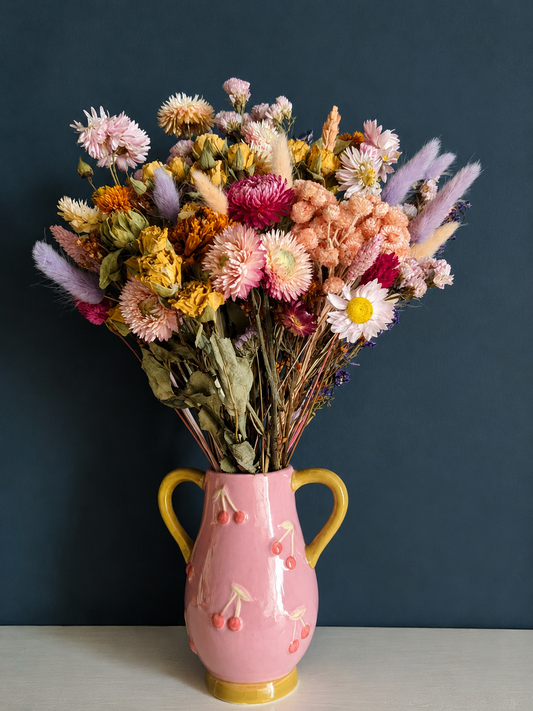 Whimsical Dried Flower Arrangement in Cherry Vase